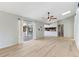 Light filled living room providing seamless indoor-outdoor living with access to the screened in pool at 2449 Running Oak Ct, Spring Hill, FL 34608