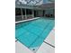Sparkling pool is surrounded by a spacious patio and a covered lanai, perfect for outdoor gatherings at 2449 Running Oak Ct, Spring Hill, FL 34608