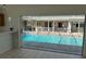 Screened-in pool area viewed from the home's interior at 2449 Running Oak Ct, Spring Hill, FL 34608