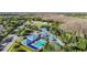 Aerial view of the community recreation area, highlighting the splash pad, swimming pools, basketball court, and building at 28402 Openfield Loop, Wesley Chapel, FL 33543