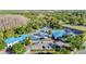 Community aerial view showing swimming pool, amenities, and parking at 28402 Openfield Loop, Wesley Chapel, FL 33543
