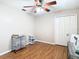 Spacious bedroom with hardwood floors, ceiling fan, and plenty of natural light at 28402 Openfield Loop, Wesley Chapel, FL 33543