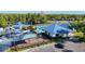 Community amenities include a pool, splash pad, playground, and shade structures, surrounded by well-maintained landscaping and ample parking at 28402 Openfield Loop, Wesley Chapel, FL 33543
