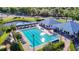The community pool features lap lanes, lounge chairs, sun shades and a gathering space in a well landscaped setting at 28402 Openfield Loop, Wesley Chapel, FL 33543