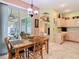 Dining room with sliding door access to screened lanai area at 28402 Openfield Loop, Wesley Chapel, FL 33543