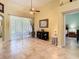 Open living area with tile flooring, decorative vase, and view of the screened-in patio at 28402 Openfield Loop, Wesley Chapel, FL 33543