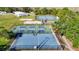 Aerial view of multiple pickleball courts with lights and fencing in a community setting at 28402 Openfield Loop, Wesley Chapel, FL 33543