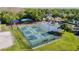 Aerial view of pickleball courts with players in a landscaped community, offering outdoor recreation at 28402 Openfield Loop, Wesley Chapel, FL 33543