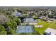 Aerial view of community amenities featuring tennis, pickleball, sand volleyball, and a community pool at 28402 Openfield Loop, Wesley Chapel, FL 33543