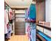 Organized walk-in closet with custom shelving and ample storage space for clothes and accessories at 28402 Openfield Loop, Wesley Chapel, FL 33543
