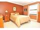 Comfortable bedroom featuring warm colors, a plush bed, and natural light at 3189 Roxmere Dr, Palm Harbor, FL 34685