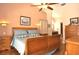 Bedroom featuring wood furniture, hardwood floors, and ample natural light, providing a warm ambiance at 3189 Roxmere Dr, Palm Harbor, FL 34685