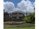 Elegant Ridgemoor community sign surrounded by beautiful landscaping and colorful flowers at 3189 Roxmere Dr, Palm Harbor, FL 34685