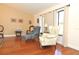 Bright living room showcasing hardwood floors, ample natural light and comfortable seating at 3189 Roxmere Dr, Palm Harbor, FL 34685