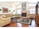Inviting living room with a fireplace, high ceilings, hardwood floors, and comfortable seating at 3189 Roxmere Dr, Palm Harbor, FL 34685