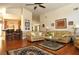 Spacious living room showcasing an open-concept layout, hardwood floors and comfortable seating at 3189 Roxmere Dr, Palm Harbor, FL 34685