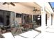 Comfortable covered patio featuring multiple ceiling fans, outdoor furniture, and an outdoor television at 3189 Roxmere Dr, Palm Harbor, FL 34685