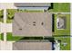 Aerial view of a home with a backyard patio space, surrounded by a white fence at 36541 Night Strawberry Ct, Dade City, FL 33525