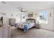 Bright bedroom with neutral carpet, ceiling fan, and lots of natural light at 36541 Night Strawberry Ct, Dade City, FL 33525