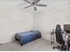 Bedroom featuring a twin bed, ceiling fan, a desk and chair at 36541 Night Strawberry Ct, Dade City, FL 33525