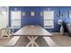 Bright dining area with table, bench, and coastal-themed decorations at 36541 Night Strawberry Ct, Dade City, FL 33525