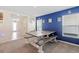 Dining area featuring a long table, bench seating, and nautical decor at 36541 Night Strawberry Ct, Dade City, FL 33525