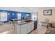 Kitchen view with counter seating and open access to the living area at 36541 Night Strawberry Ct, Dade City, FL 33525
