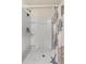 The shower features a shower head, shelves and a curtain with a marine life theme at 36541 Night Strawberry Ct, Dade City, FL 33525