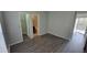 Serene bedroom featuring gray walls, modern flooring, and a sliding door to the outside at 4107 Chatham Oak Ct # 326, Tampa, FL 33624