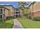 Attractive condo complex featuring lush landscaping and well-maintained common areas at 4107 Chatham Oak Ct # 326, Tampa, FL 33624