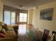 Bright living room with hardwood floors and sliding doors leading to a balcony at 4107 Chatham Oak Ct # 326, Tampa, FL 33624