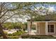Lush landscaping surrounds the sparkling community pool with nearby clubhouse at 4107 Chatham Oak Ct # 326, Tampa, FL 33624