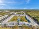 Extensive aerial shot of the condominium complex featuring landscaping, pool, and parking at 4720 Locust Ne St # 206, St Petersburg, FL 33703