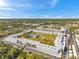 A high-angle aerial shot of the condominium community nestled amongst mature landscaping at 4720 Locust Ne St # 206, St Petersburg, FL 33703