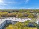 Beautiful aerial view of the condo community with skyline, mature trees, and city views at 4720 Locust Ne St # 206, St Petersburg, FL 33703