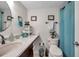 This bathroom has a clean white toilet and large blue shower curtain. Stylish, organized and practical at 4720 Locust Ne St # 206, St Petersburg, FL 33703