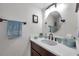 Charming half bathroom with vanity and vessel sink, enhanced by stylish fixtures and decor at 4720 Locust Ne St # 206, St Petersburg, FL 33703