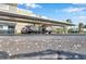 Carport provides covered parking for residents with dedicated parking spaces, set against a backdrop of trees at 4720 Locust Ne St # 206, St Petersburg, FL 33703