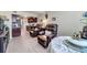 This living area features dark wood look flooring and a view into the modern kitchen at 4720 Locust Ne St # 206, St Petersburg, FL 33703