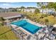 Community pool with multiple lounge chairs, tables, and well-maintained surroundings for resident enjoyment at 4720 Locust Ne St # 206, St Petersburg, FL 33703