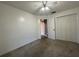 Bedroom with ceiling fan and a double door closet to maximize storage space at 4731 Portobello Cir, Valrico, FL 33596