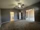 Spacious main bedroom features sliding glass doors, ceiling fan, and ensuite bathroom at 4731 Portobello Cir, Valrico, FL 33596