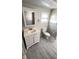 Functional bathroom with a vanity, mirror, toilet, and good lighting at 4851 W Gandy Blvd # B2L11, Tampa, FL 33611