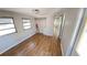 Cozy bedroom featuring wood-look floors, closet, and ample natural light at 4851 W Gandy Blvd # B2L11, Tampa, FL 33611