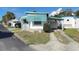 Charming single-story home featuring covered parking, front awning, and quaint landscaping at 4851 W Gandy Blvd # B2L11, Tampa, FL 33611