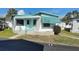 Charming single-story home featuring a quaint porch and a freshly painted door at 4851 W Gandy Blvd # B2L11, Tampa, FL 33611