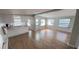 A light-filled living room features modern flooring and flows into the kitchen at 4851 W Gandy Blvd # B2L11, Tampa, FL 33611