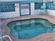 Relaxing spa area with clear water, brick surround, and warning sign at 4851 W Gandy Blvd # B2L11, Tampa, FL 33611