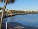 Picturesque waterfront view with palm trees, showcasing the scenic beauty of the community at 4851 W Gandy Blvd # B2L11, Tampa, FL 33611