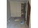Dilapidated bathroom with a toilet, sink, and shower stall visible through the doorway at 613 Chestnut St, Oldsmar, FL 34677